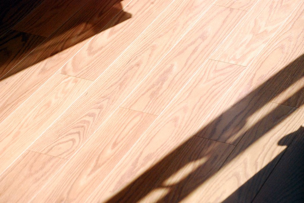 Sunlit solid-oak floor, straight lay